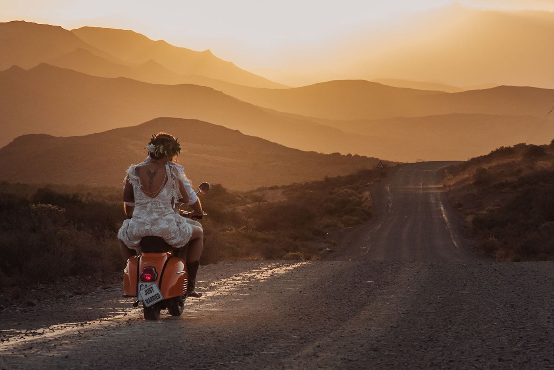 Bride on the back of a motorcycle Molteno Couture designer bridal cape town sunset wedding